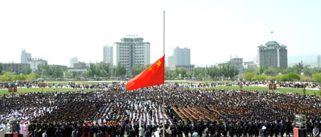 Tens of thousands of citizens mourn during a silent tribute at Xinning Square in Xining, capital of northwest China's Qinghai Province, May 19, 2008.