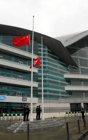 China's national flag flies at half-mast after the flag-raising ceremony at a square in Hong Kong, south China, May 19, 2008. China on Monday begins a three-day national mourning for the tens of thousands of people killed in a powerful earthquake which struck southwest China's Sichuan province on May 12.
