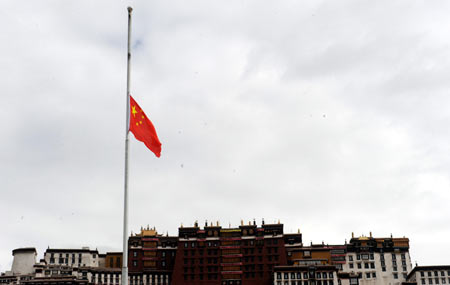 China's national flag flies at half-mast in front of the Potala Palace in Lhasa, southwest China's Tibet Autonomous Region, May 19, 2008. China on Monday begins a three-day national mourning for the tens of thousands of people killed in a powerful earthquake which struck the country's southwestern regions on May 12.