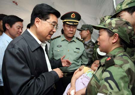 Chinese President Hu Jintao Friday went to Beichuan County of Mianyang City to visit people affected by the southwest China earthquake, encouraging them to be confident in overcoming hardships caused by the disaster.