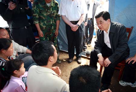 Chinese President Hu Jintao Friday went to Beichuan County of Mianyang City to visit people affected by the southwest China earthquake, encouraging them to be confident in overcoming hardships caused by the disaster.