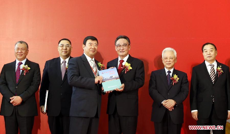 Wu Bangguo (3rd R), chairman of the National People's Congress (NPC) Standing Committee, attends the inauguration ceremony of the gallery commemorating the Basic Law of Macao and the launching ceremony of the publication of a book on the significant changes in the history of Macao, in Macao, south China, Feb. 21, 2013. (Xinhua/Ju Peng) 
