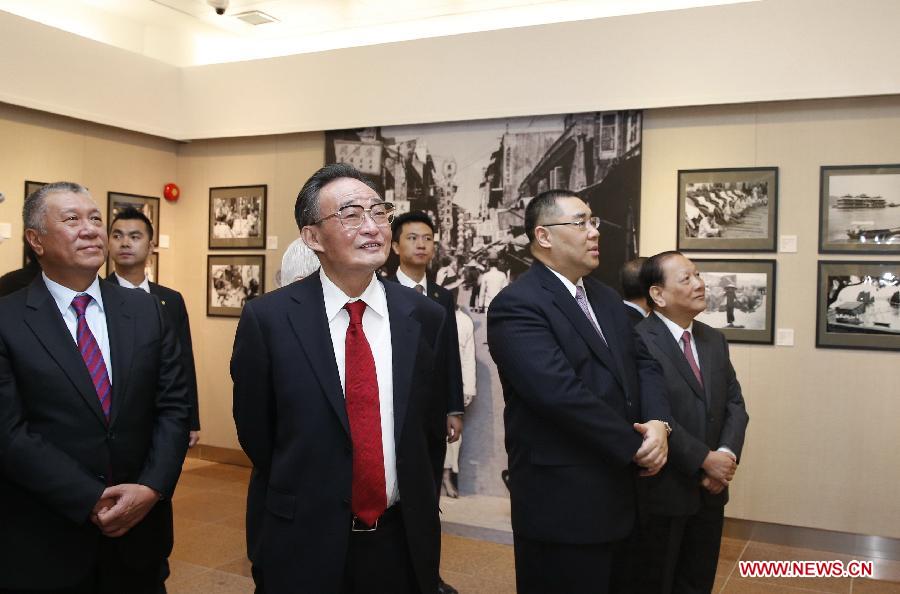 Wu Bangguo (C, Front), chairman of the National People's Congress (NPC) Standing Committee, visits the gallery commemorating the Basic Law of Macao, in Macao, south China, Feb. 21, 2013. Wu attended the inauguration ceremony of the gallery as well as the launching ceremony of the publication of a book on the significant changes in the history of Macao here on Thursday. (Xinhua/Ju Peng)
