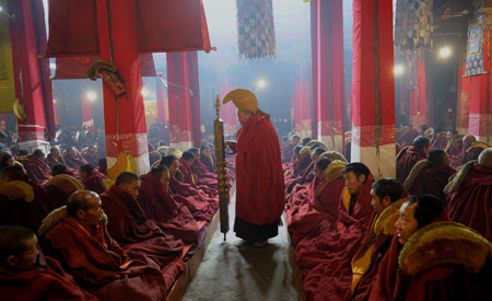 Tibetan Buddhists debate on Buddhism scriptures during a Buddhist ceremony at the Sera Monastery in the suburb of Lhasa, capital of southwest China's Tibet Autonomous Region, March 4, 2009. The seven-day annual religious ceremony, starting on the 8th day of the first month in the Tibetan calendar, is held to pray for peace and safety, as Tibetan Buddhists debate on Buddhism scriptures and Buddhism followers worship Buddha and give alms. (Xinhua/Purbu Zhaxi)