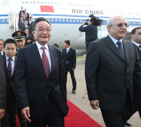 Wu Bangguo (L, Front), chairman of the Standing Committee of China's National People's Congress, is welcomed by Abdelaziz Ziari (R), Speaker of Algeria's National Assembly, upon his arrival at an airport in Algiers, capital of Algeria, on Nov. 3, 2008.