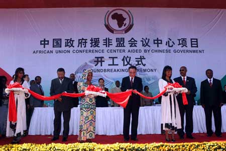 Wu Bangguo (front C), chairman of the Standing Committee of China's National People's Congress(NPC), the country's top legislature, and Chairman of the African Union Commission Jean Ping (front 2nd L) cut the ribbon to open the ground breaking ceremony for the African Union Conference Center aided by Chinese government in Addis Ababa, capital of Ethiopia, on Nov. 10, 2008. 