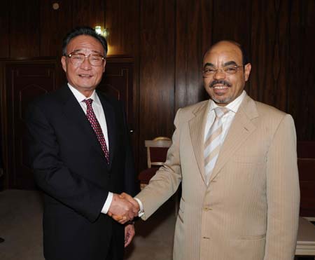 Ethiopian Prime Minister Meles Zenawi (R) shakes hands with Wu Bangguo, chairman of the Standing Committee of China's National People's Congress(NPC), the country's top legislature, during their meeting in Addis Ababa, capital of Ethiopia, Nov. 10, 2008.