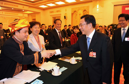 Chinese leaders underscored the importance of relying on the people in the combat against the global financial turmoil, urging efforts to ensure their well-being, when joining lawmakers and political advisors in panel discussions Friday.