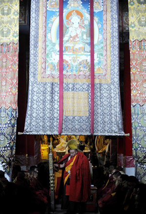 Tibetan Buddhists chant Buddhism scriptures during a Buddhist ceremony at the Sera Monastery in the suburb of Lhasa, capital of southwest China's Tibet Autonomous Region, March 4, 2009.