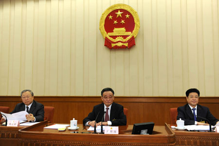 Wu Bangguo (C), chairman of the Standing Committee of the National People's Congress (NPC), presides over the eighth session of the 11th NPC Standing Committee, at the Great Hall of the People in Beijing, capital of China, on April 24, 2009. The five-day session concluded here Friday. (Xinhua/Li Tao)