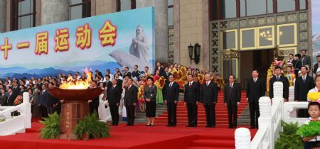 People attend the starting ceremony of the 11th National Games torch relay at the east gate of the Great Hall of the People in Beijing, China, on Aug. 16, 2009. The 11th edition of the National Games, which are held every four years, will take place in Shandong Province from Oct. 16 to 28. (Xinhua/Pang Xinglei)