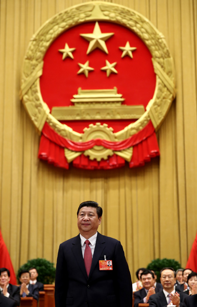 Xi Jinping greets deputies at the fourth plenary meeting of the first session of the 12th National People's Congress (NPC) in Beijing, capital of China, March 14, 2013. Xi was elected president of the People's Republic of China (PRC) and chairman of the Central Military Commission of the PRC at the NPC session here on Thursday. (Xinhua/Lan Hongguang)