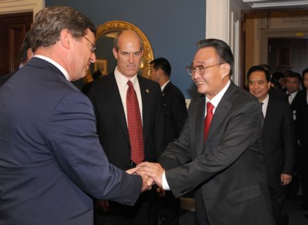 Wu Bangguo (R FRONT), chairman of the Standing Committee of China's National People's Congress, meets with chairmen of the US-China Inter-parliamentary Exchange Group, the U.S.-China Working Group as well as other groups under the U.S. House of Representatives, in Washington, the United States, Sept. 9, 2009. (Xinhua/Ma Zhancheng)