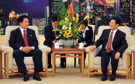 Wang Zhaoguo (R), vice chairman of the Standing Committee of China's National People's Congress, meets with Kil Chol Hyok, secretary of the central committee of the Kim Il Sung Socialist Youth League of the DPRK, in Beijing, capital of China, Sept. 22, 2009. Wang Zhaoguo said on Tuesday that China would make joint efforts with the Democratic People's Republic of Korea (DPRK) to push forward bilateral ties on the occasion of the 60th anniversary of the establishment of diplomatic relations between the two countries. (Xinhua/Xie Huanchi)