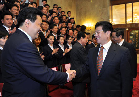 Wang Zhaoguo (R), vice chairman of the Standing Committee of China's National People's Congress, shakes hands with Kil Chol Hyok, secretary of the central committee of the Kim Il Sung Socialist Youth League of the DPRK, in Beijing, capital of China, Sept. 22, 2009. Wang Zhaoguo said on Tuesday that China would make joint efforts with the Democratic People's Republic of Korea (DPRK) to push forward bilateral ties on the occasion of the 60th anniversary of the establishment of diplomatic relations between the two countries. (Xinhua/Xie Huanchi)
