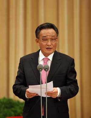 Wu Bangguo, chairman of the National People's Congress Standing Committee, presides over a ceremony commemorating the 30th anniversary of the announcement of Message to Compatriots in Taiwan held in Beijing, capital of China, on Dec. 31, 2008. The Chinese mainland commemorated the 30th anniversary of the announcement of Message to Compatriots in Taiwan here Wednesday with a ceremony attended by three top leaders including President Hu Jintao. (Xinhua/Yao Dawei) 