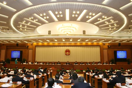 Wu Bangguo (C), chairman of the Standing Committee of China's National People's Congress (NPC), presides over the closing session of the 31st session of the 10th NPC Standing Committee in Beijing, capital of China, on Dec. 29, 2007. 