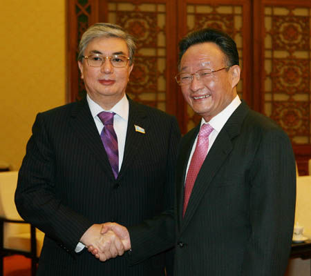China's top legislator Wu Bangguo (R) shakes hands with Kasymzhomart Tokaev, chairman of the Senate of Kazakhstan, in Beijing, China, Jan. 25, 2008.